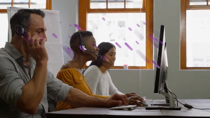 Animation of shapes moving over diverse business people working in office