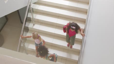 video of top view of diverse girls walking downstairs at school