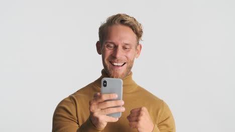 cheerful man with gray smartphone