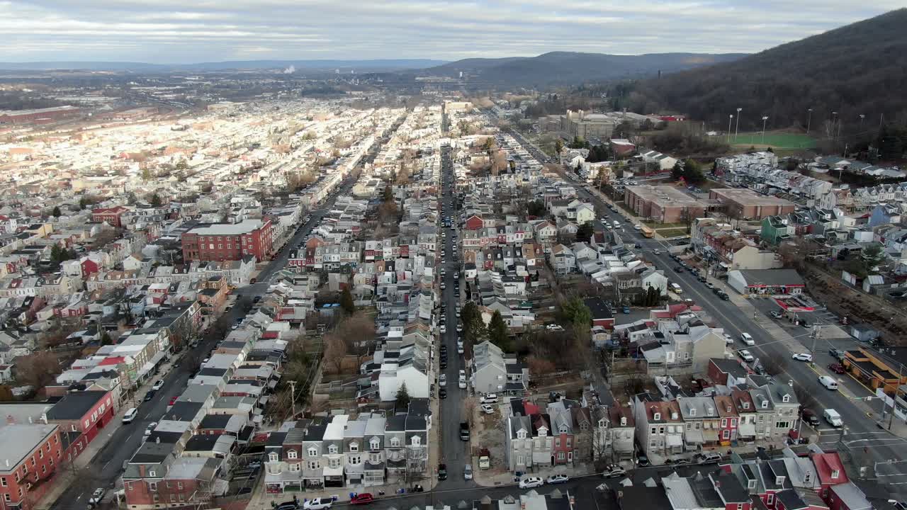 Reading, Pennsylvania high aerial drone truck shot, urban housing, densely populated residential district, low-income housing, rental properties, homes, businesses