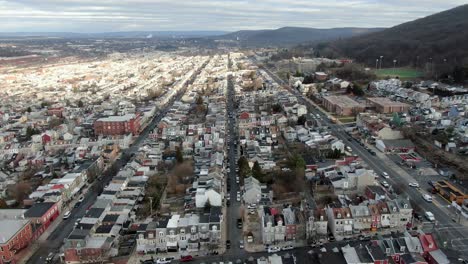 reading, pennsylvania high aerial drone truck shot, urban housing, densely populated residential district, low-income housing, rental properties, homes, businesses