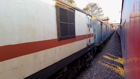 passenger-train-running-on-track-crossing-each-other-from-opposite-direction-at-morning-video-is-taken-at-new-delhi-railway-station-on-Aug-04-2022