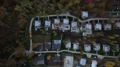 flight-parallel-to-summer-cottages-with-beautiful-small-houses-between-the-trees-where-comfort-has-been-created-for-a-quiet-life-in-a-quiet-environment-outside-the-city