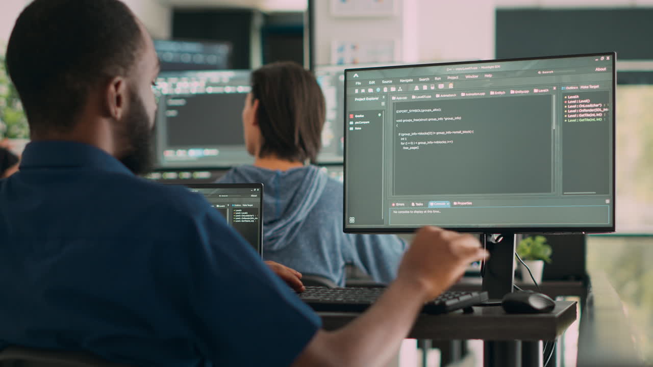 African american system engineer working on software development with source code