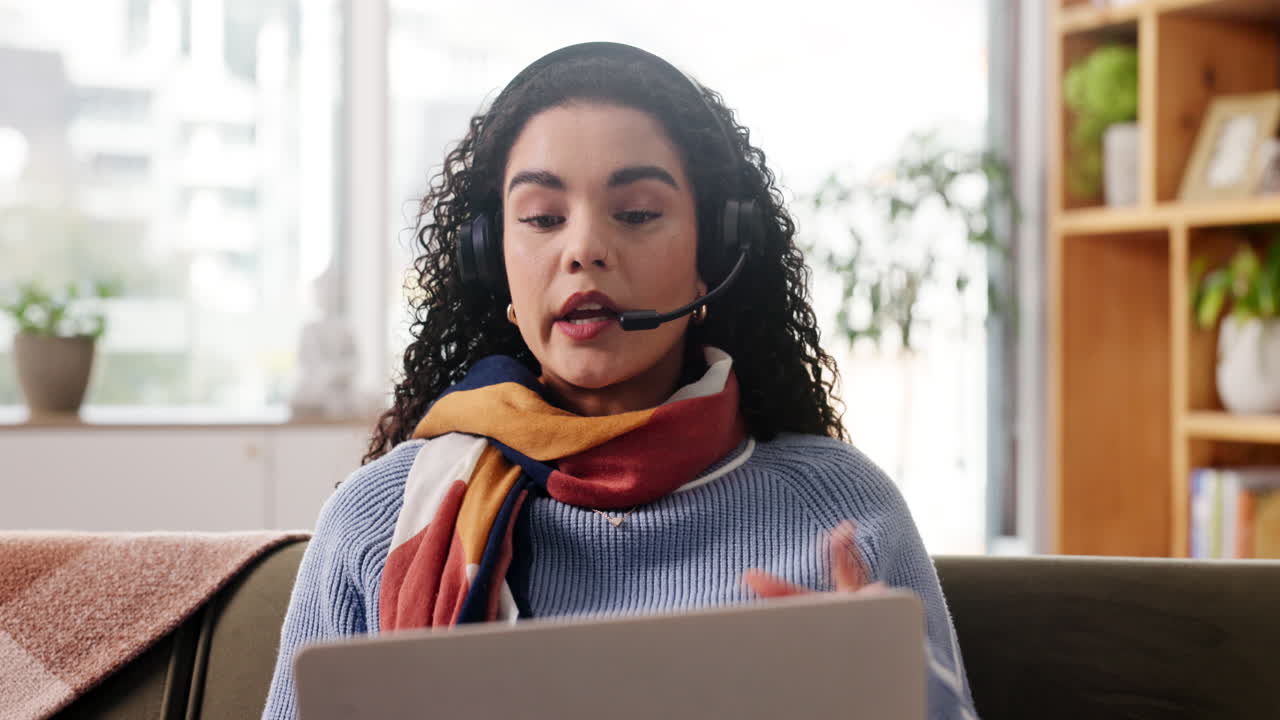 Woman on Video Call with Laptop and Headset
