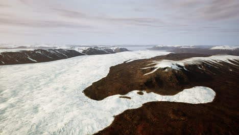 aerial view of a snowy mountain landscape