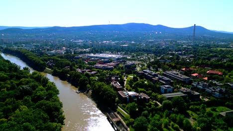Aerial-View-Of-Tranquil-River-In-Obuda-Island,-Budapest,-Hungary---drone-shot
