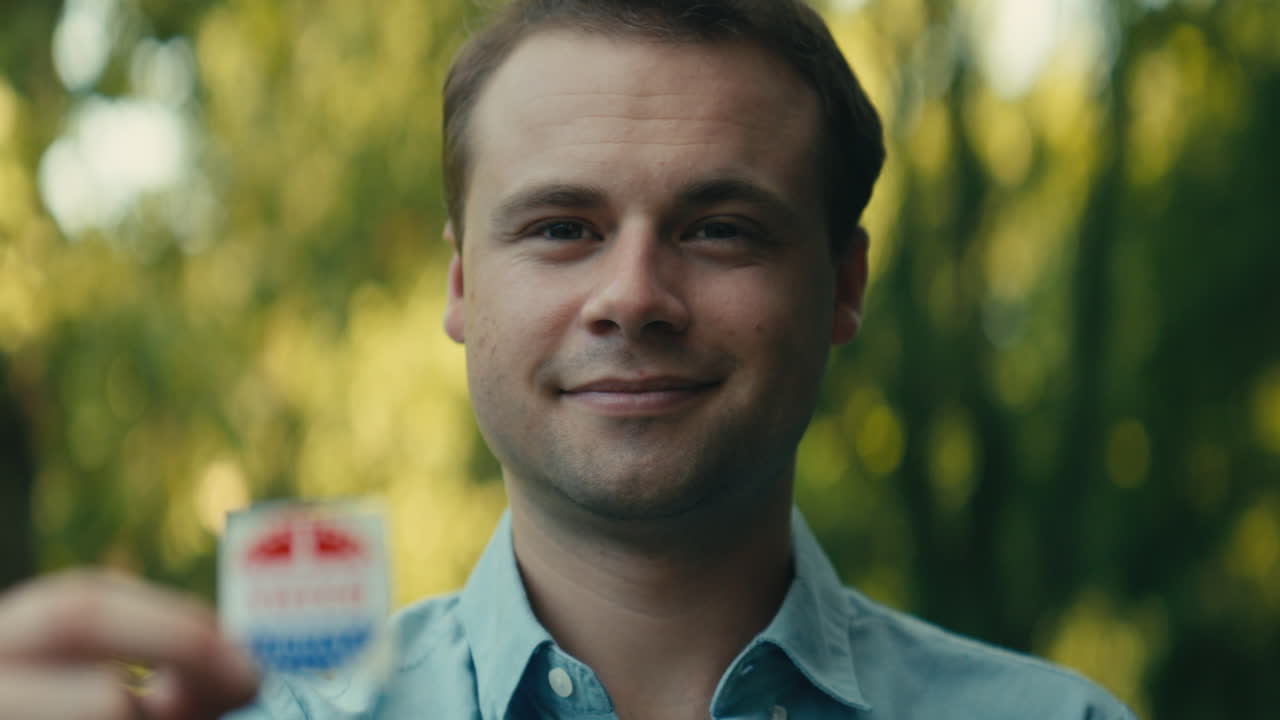 Man showing 'I Voted' sticker
