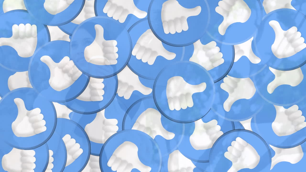 Animation of falling emojis over woman in hijab using smartphone