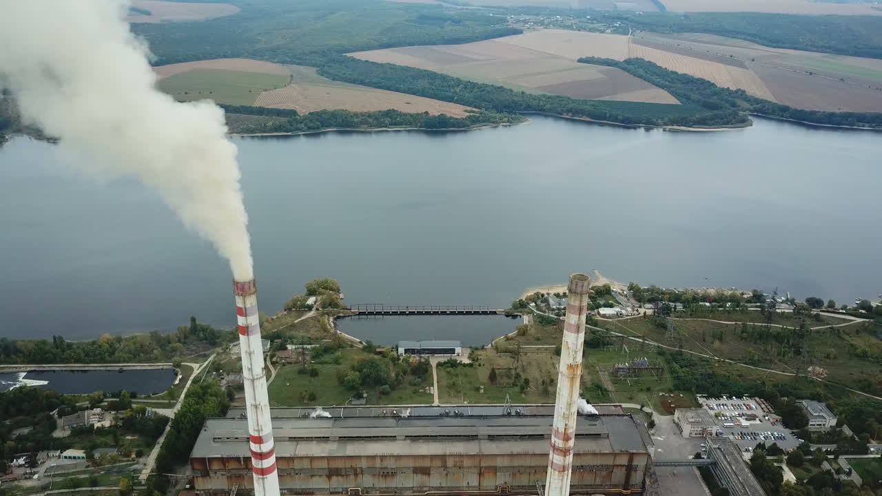 Power station establishing shot, aerial view. Energy production and heavy industry concept