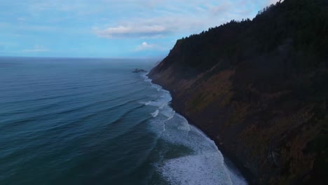 rugged dramatic untouched coastline aerial drone california surf waves crashing boulder rocks usal beach campground cloudy mist fog pnw lost coast trail morning nature landscape forwards circle