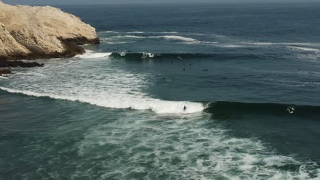 Aerial-shot-of-surfers-riding-waves