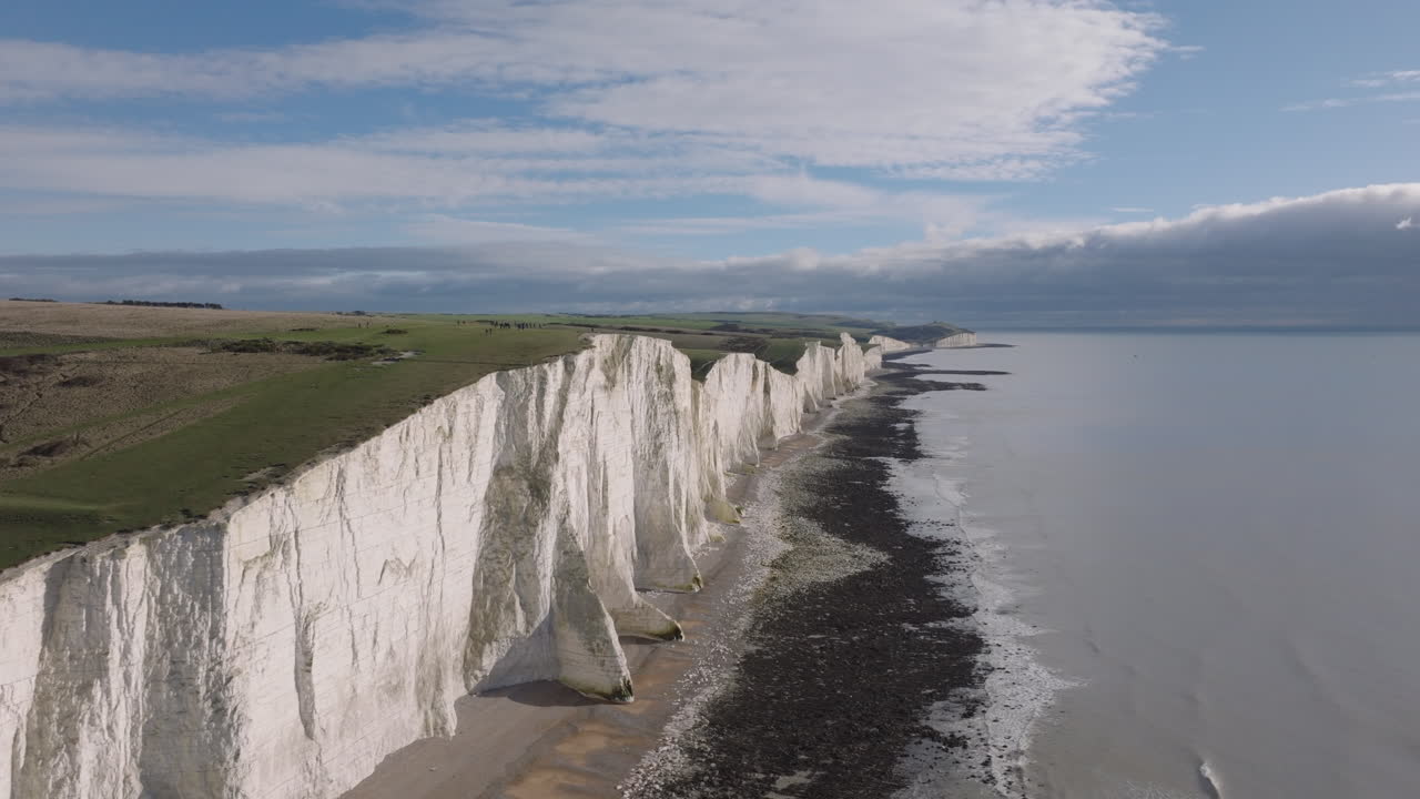 Revealing aerial slider shot of the seven sisters chalk cliffs on the south coast of England