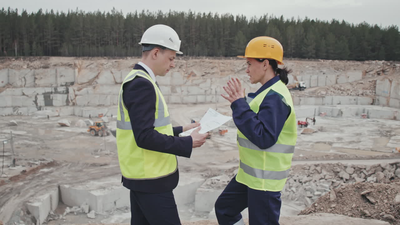 Female Supervisor and Quarry Manager Discussing Work