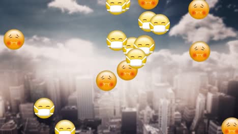 animation of emojis falling over a cityscape in the background.