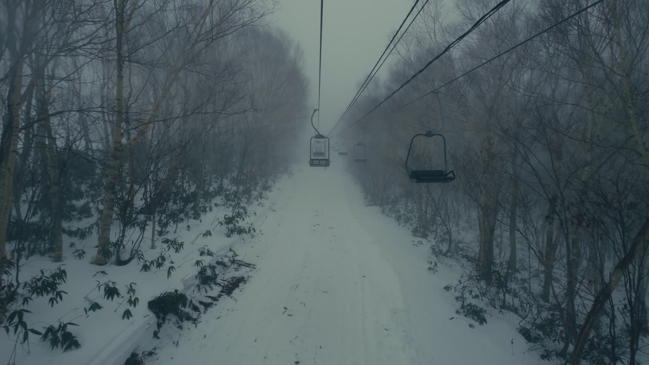 Mountain ski lift with heavy snow in Japan