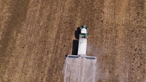 Mounted-Tractor-Working-On-Field-Adding-Lime-To-The-Natural-Soil