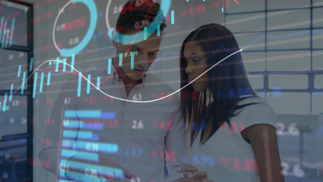 Man holding tablet initiating animated finance charts while woman tapping and analyzing market data