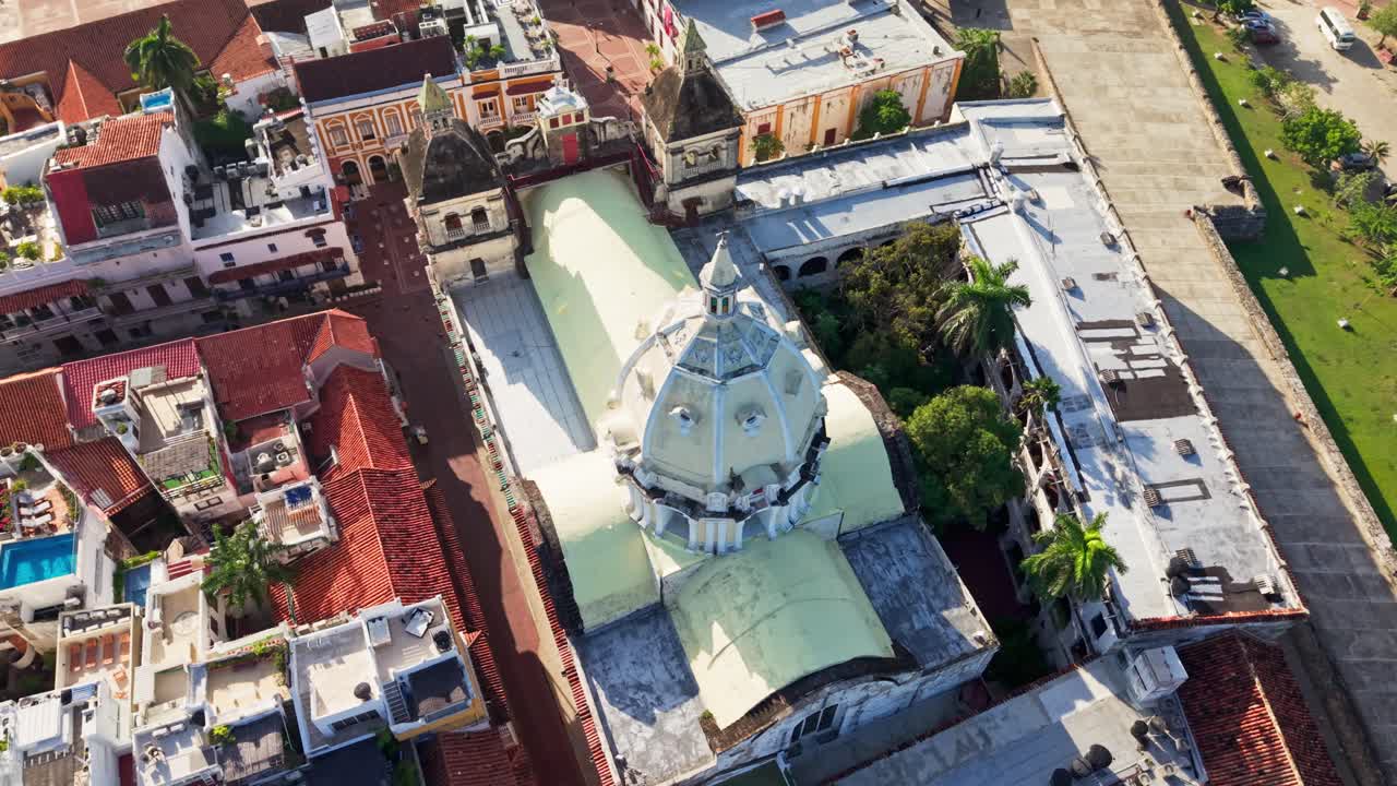 Slow motion aerial view of the San Pedro Claver church and cityscape of Cartagena, Colombia