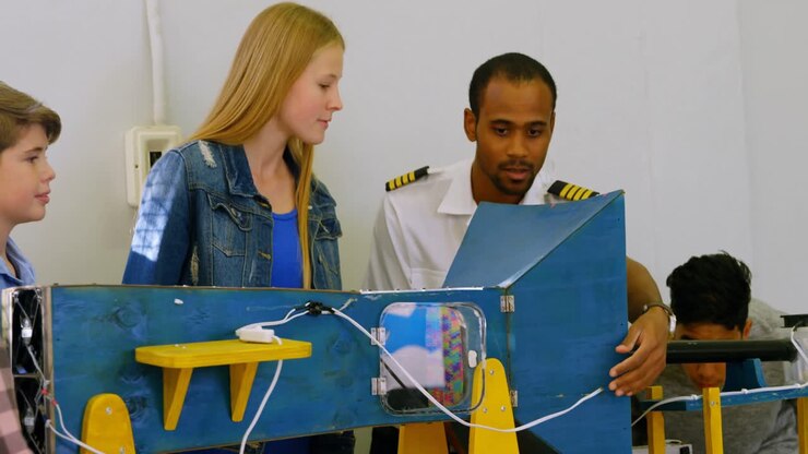 Male pilot explaining about machine to kids 4k