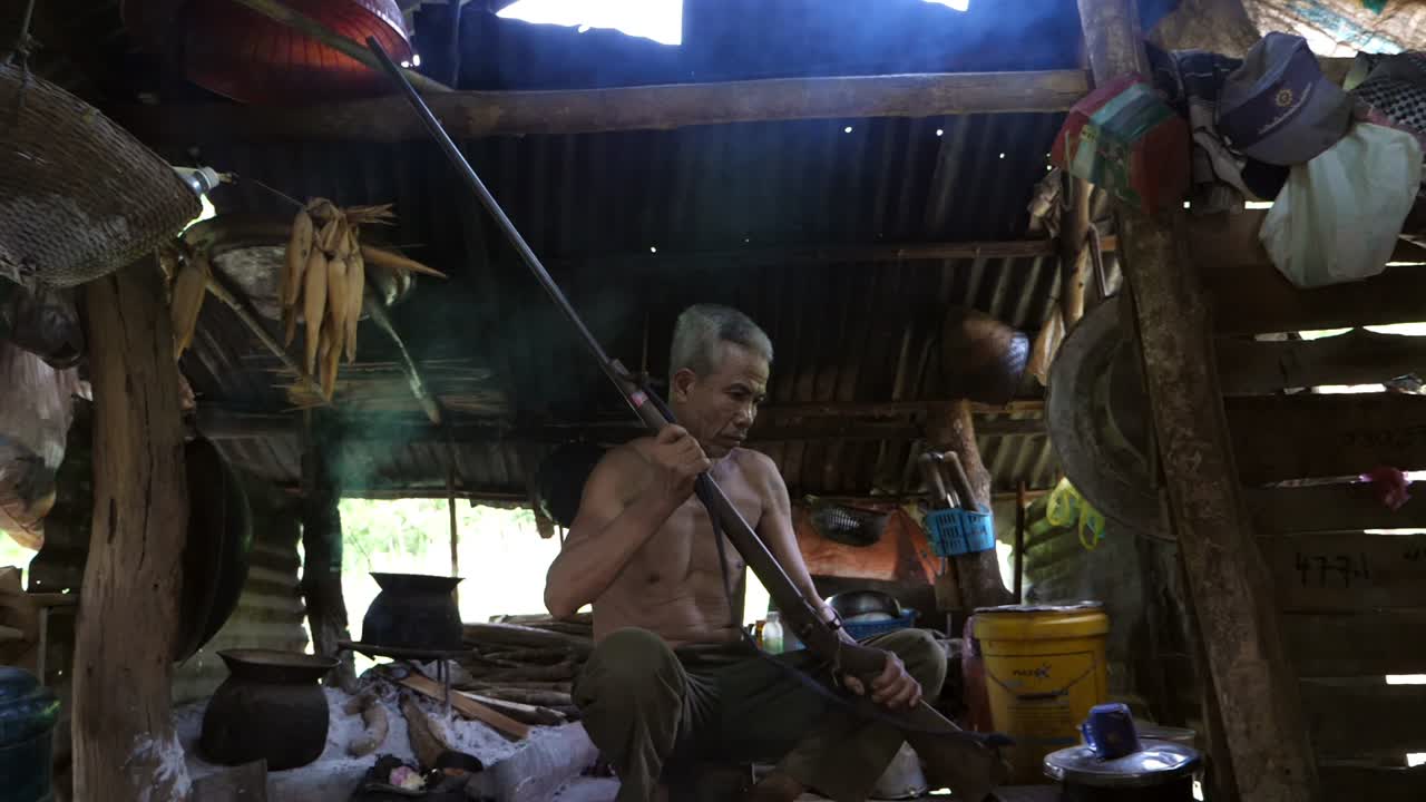 Asian The Elderly Man Check His Gun