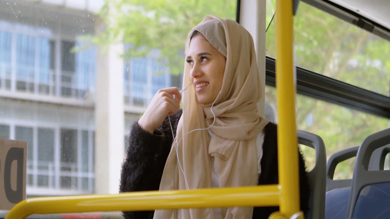 Woman in hijab talking on mobile phone 4k