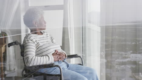 Caucasian-female-nurse-in-face-mask,-senior-african-american-woman-with-oxygen-mask,-slow-motion