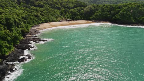 aerial shot turning towards an island bay