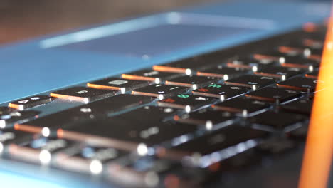 portable laptop computer keyboard in close up panning view in office