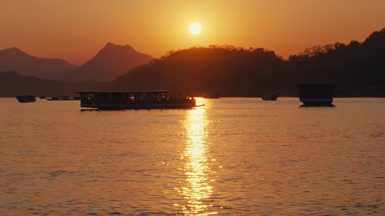 Sunset River Cruise with Boats and Mountains