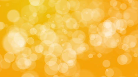 motion abstract bokeh of light spots on a soft yellow background. looped holiday animation.
