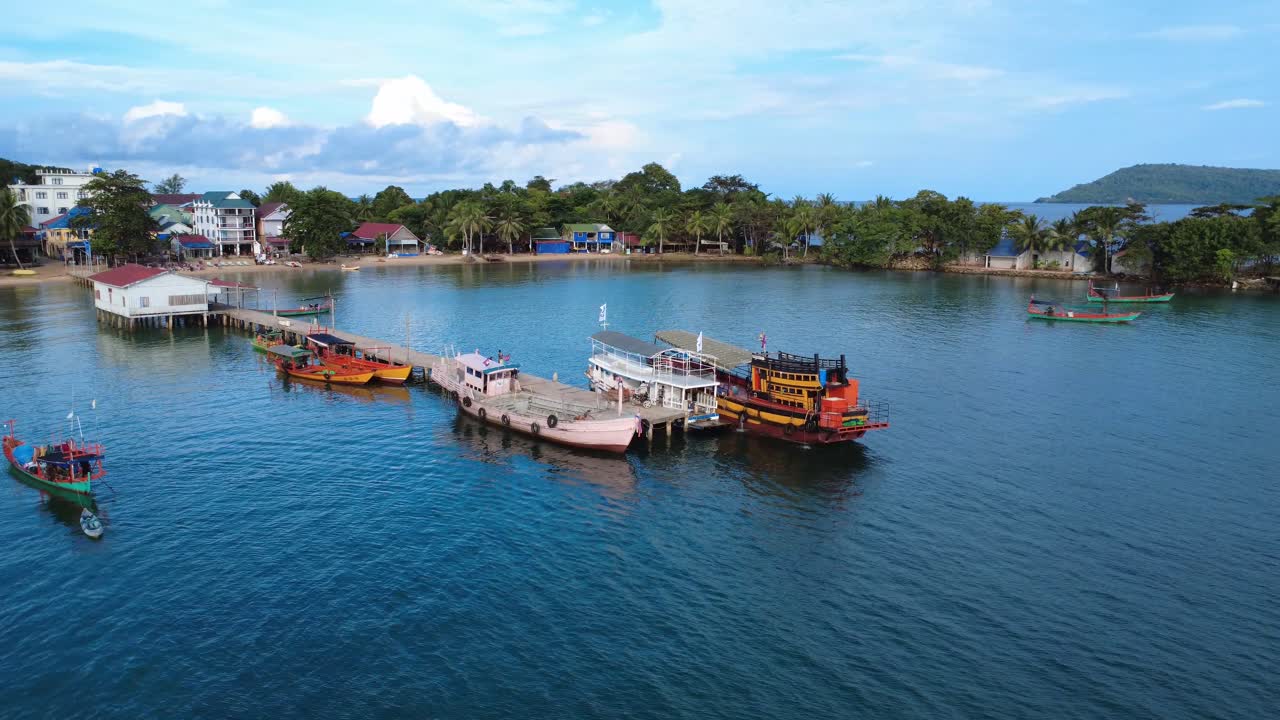 Koh Rong island fishing village pier, tropical Southeast Asia exotic, aerial drone