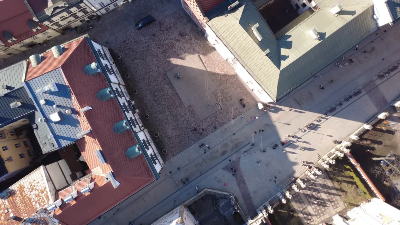 Aerial Top Down View of a Busy City Square with People Walking