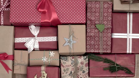 stack of christmas presents on wooden background