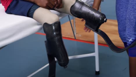 man exercising with prosthetic legs