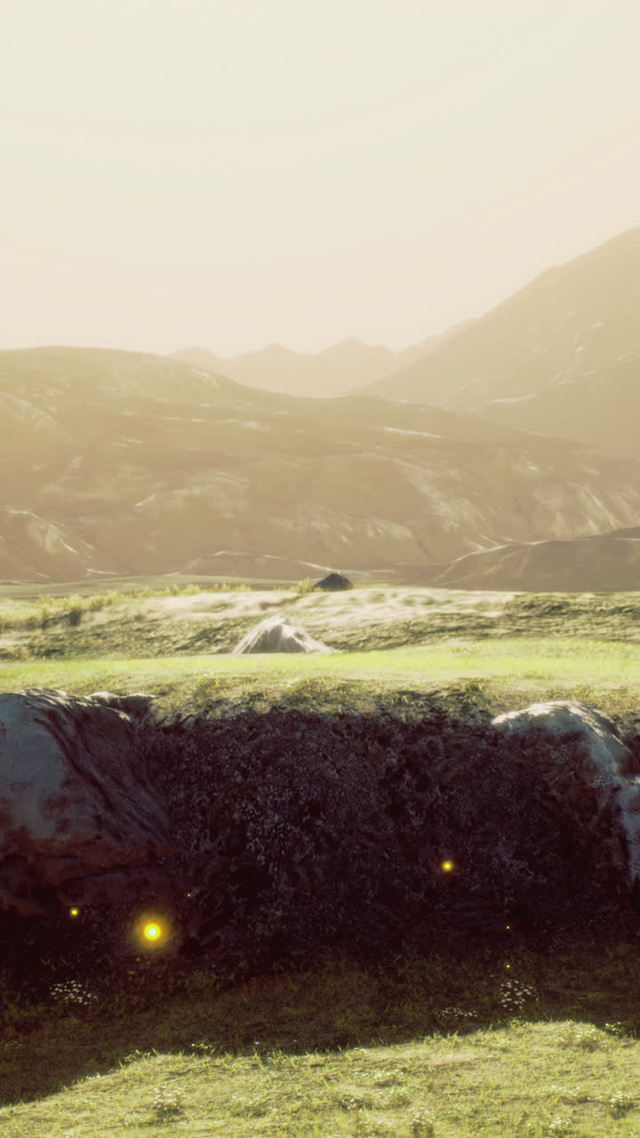 Majestic landscape with glowing lights in the meadow at sunset