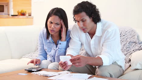 couple adding up their bills