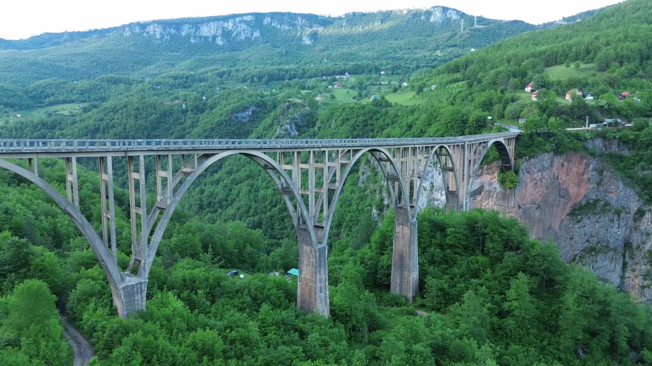 The Tara Bridge, a concrete arch bridge surrounded by lush forests within Durmitor National Park, Drone, Panorama