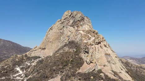 La-Peña-de-Bernal-is-the-third-largest-monolith-in-the-world,-located-in-the-town-of-Bernal-which-is-in-the-municipality-of-Ezequiel-Montes-in-the-state-of-Querétaro,-Mexico