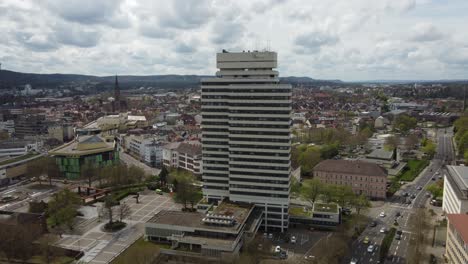 aerial dolly in of city hall tower, shopping mall and kaiserslautern downtown skyline cityscape, germany