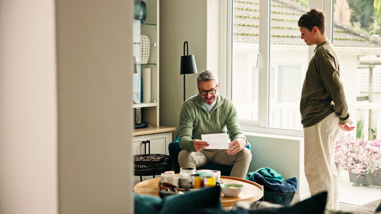 Father and Son Celebrating Achievement at Home