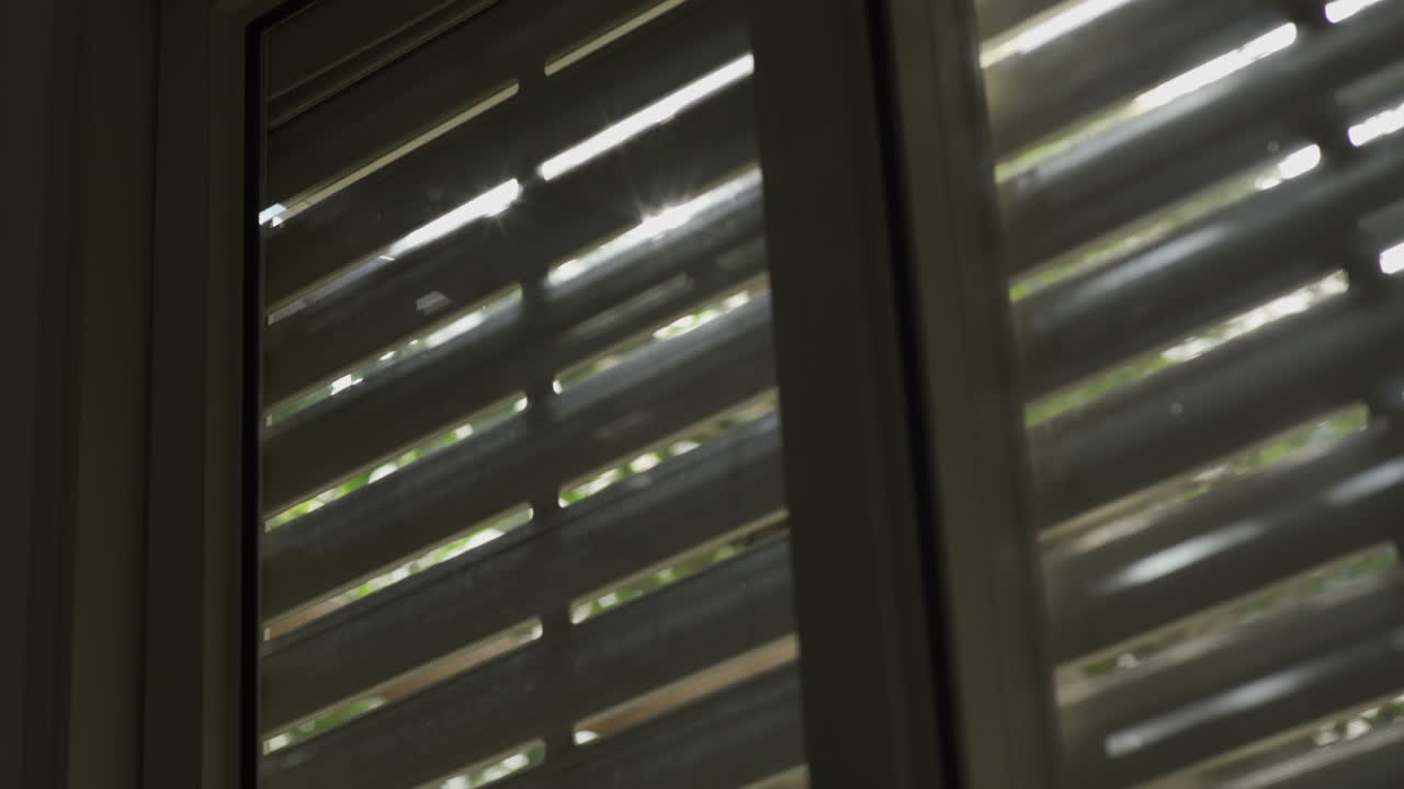 Window with electric shutters are being closed shut