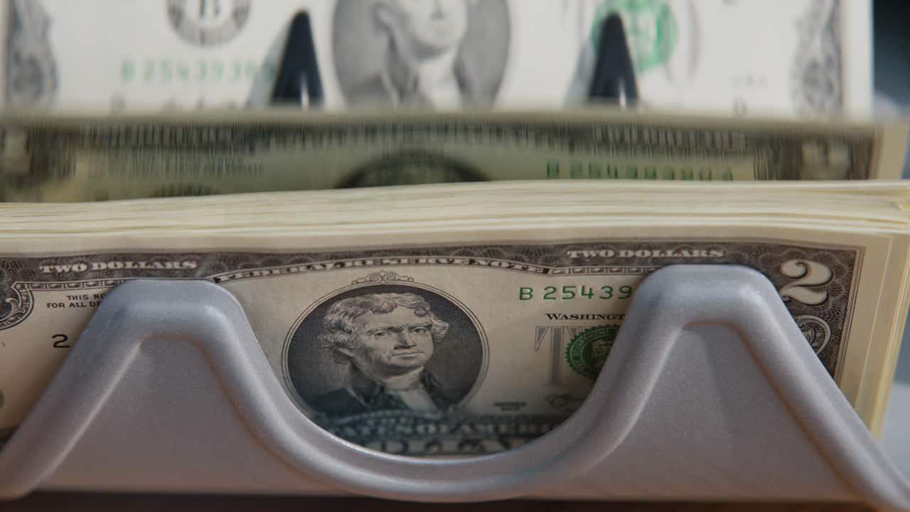 Dollar bills calculating electronic counter closeup. Equipment counting currency