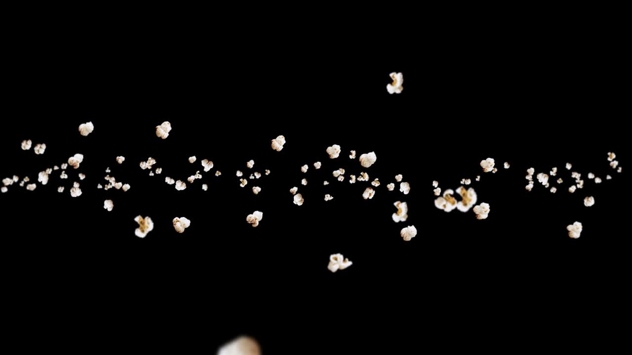 Flying many popcorns on black background. White salty popcorn. Healthy food. Corn seed. 3D loop animation of popcorn rotating.