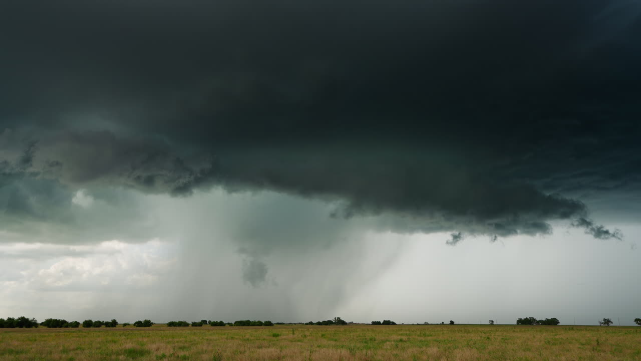 Atmospheric Motion and Beauty in Storm Clouds Sweeping Through Farmlands
