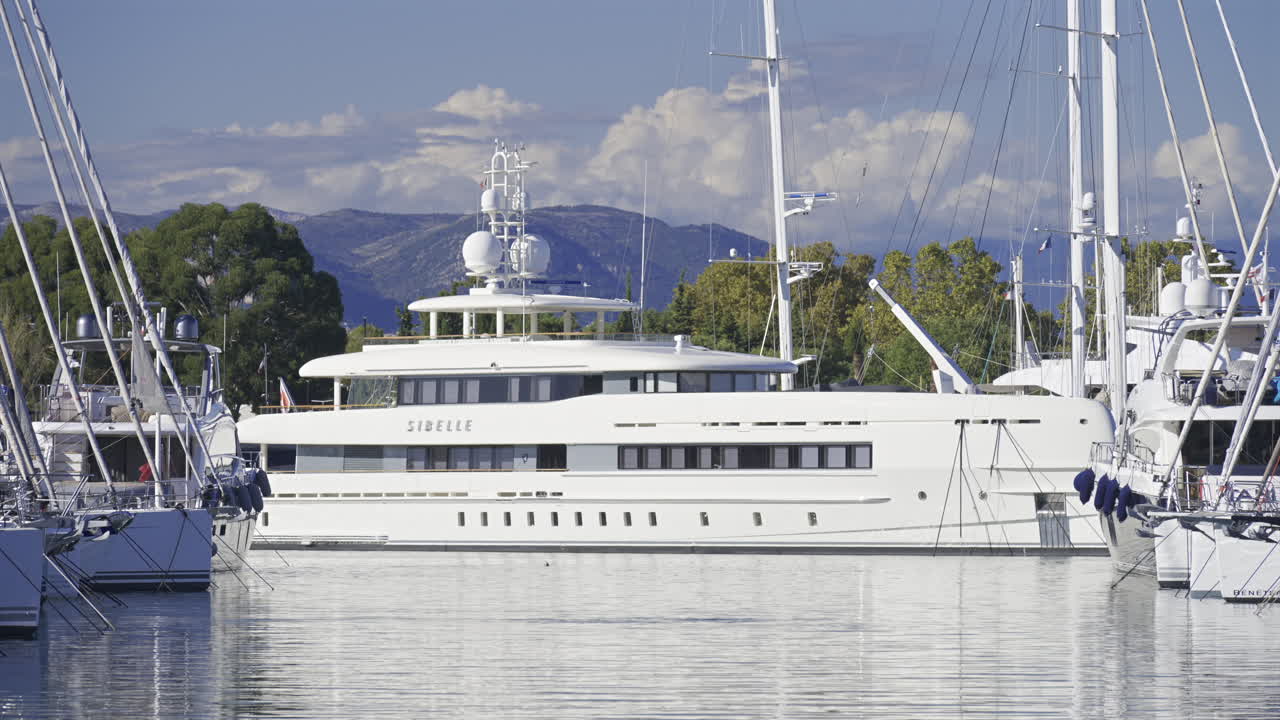 Antibes, France - June 7, 2025: Multiple white boats docked in the Port Vauban in daylight