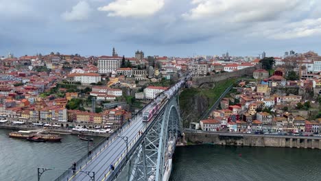 Porto,-Portugal-from-above-overlooking-Dom-Luis-1-bridge,-Douro-river-and-Porto-city