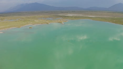aerial view of a kayaker rowing on a blue lake in cuatro cienegas, coahuila, mexico