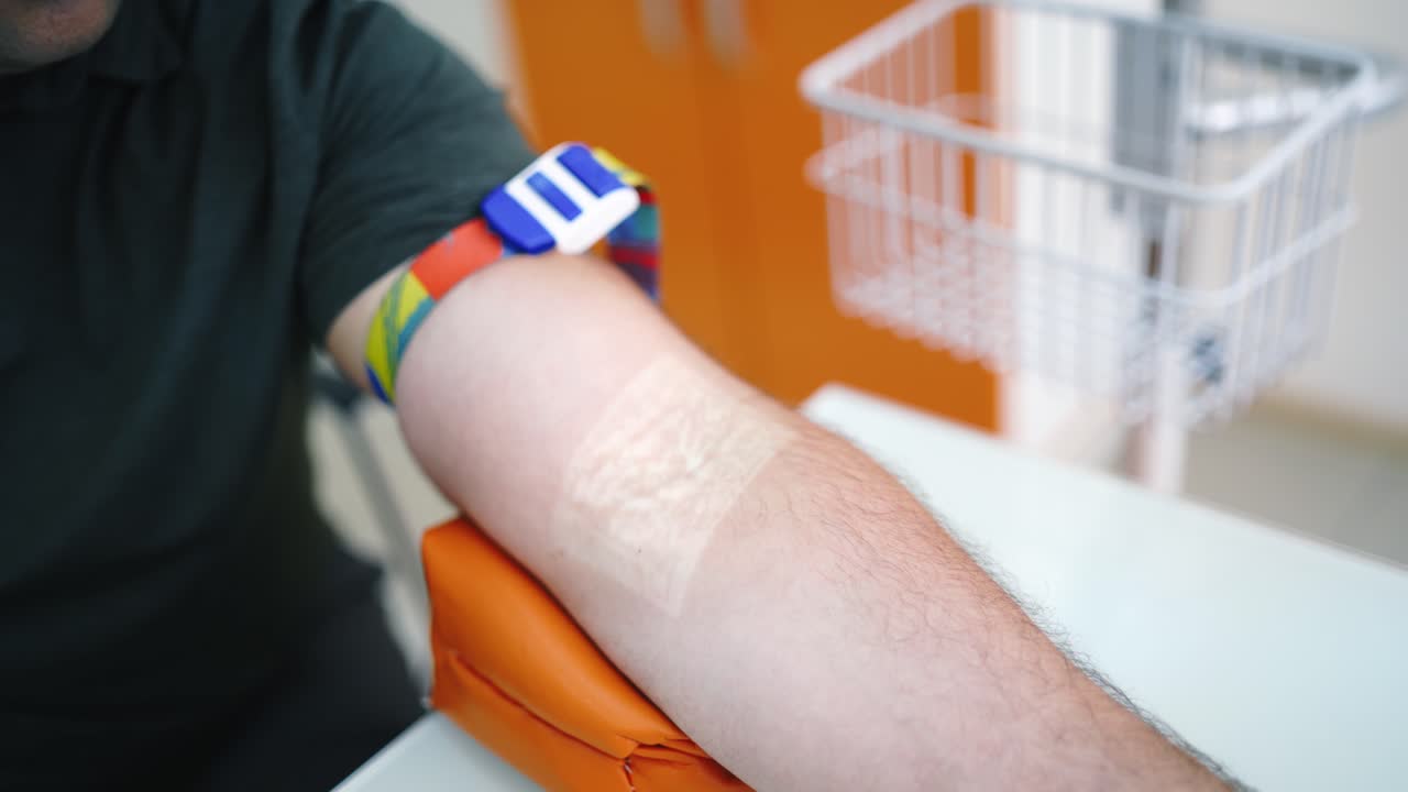Close up of blood sampling. Doctor take blood sample from vein for testing