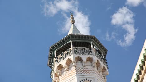 detail of tall tunisian tower with arabic moorish architecture styles, exterior facade decorated